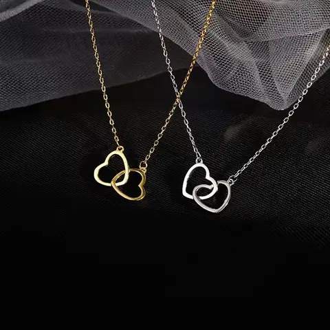 Collier en titane et acier pour femme. Bijoux fin double coeur.